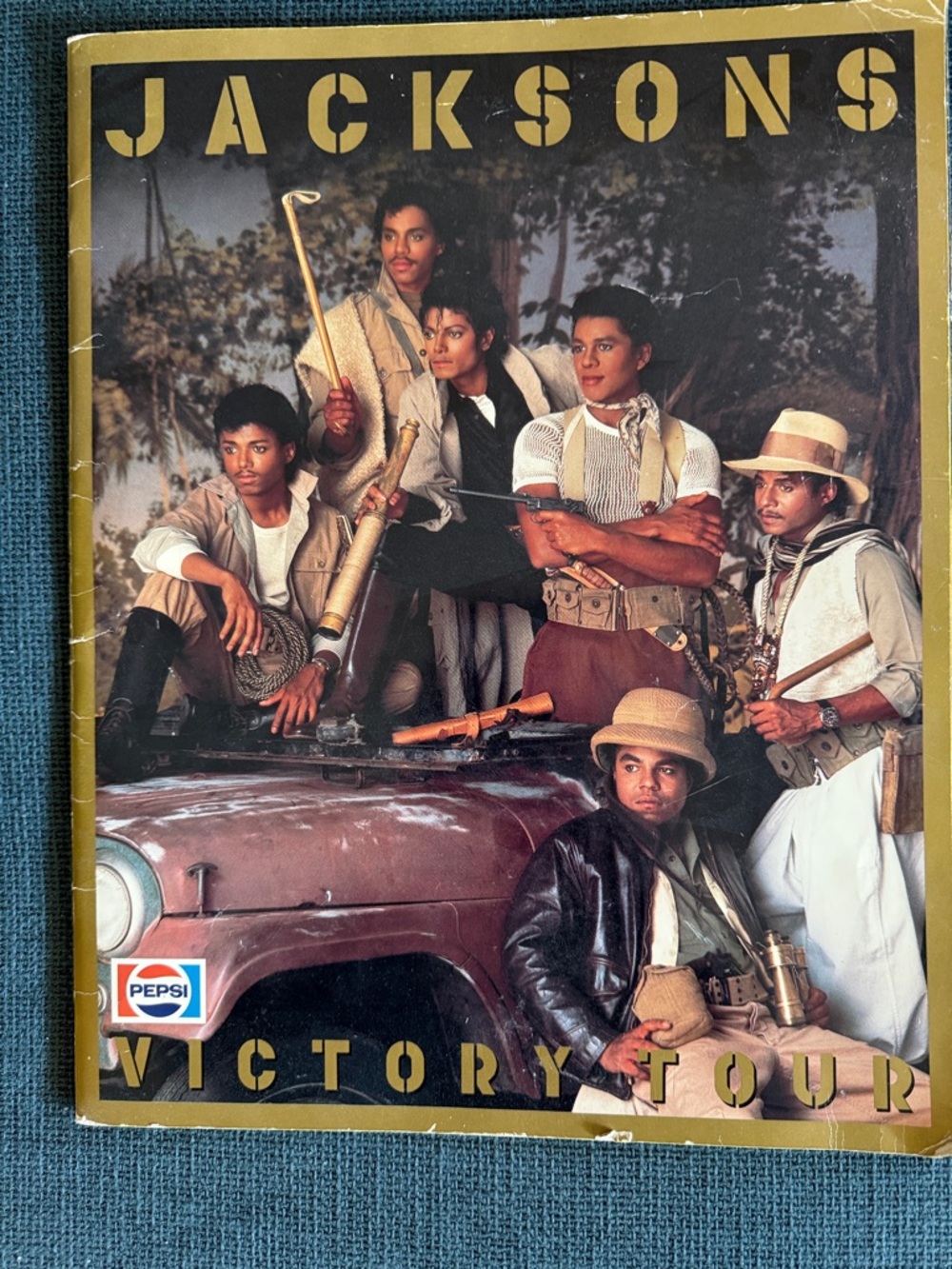 Pepsi Logo on Vintage Jacksons Victory Tour Poster with Gold, Black, Brown